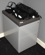 1 x Metal Office Drawer Pedestal with Cushioned Seat and a Selection of Laptop Chargers and Keyboard