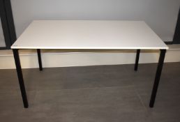 4 x Office Tables Featuring White Tops and Black Metal Bases - Dimensions: 140 x 80 cms
