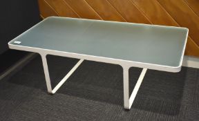 1 x Coffee Table Featuring a White Metal Frame and Smoked Glass Insert