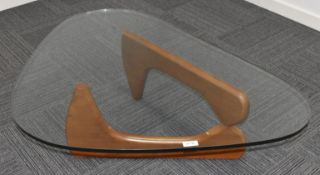 1 x Glass Coffee Table Featuring an Abstract Wooden Base