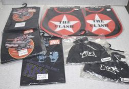 7 x Assorted Baby Items Including Trex Bonnet Hats, Kiss Baby Suits and The Clash Bibs -