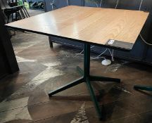 1 x Restaurant Dining Table Featuring a Light Wooden Top and Green Pedestal Base
