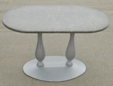 1 x Oval Commercial Bistro Table Featuring a Heavy Duty Metal Twin Pedestal Base and Stonecast Top -
