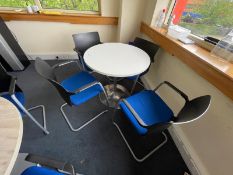 1 x Round Office Meeting Table Featuring an White Finish and Four Stackable Office Chairs