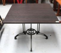 1 x Contemporary Restaurant Table Featuring a Dark Grained Wooden Top and an Ornate Pedestal