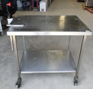 1 x Stainless Steel Mobile Prep Table Featuring Castor Wheels, Can Opener and Undershelf