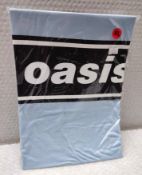 1 x Oasis Band T-Shirt - Colour: Blue - Size: Extra Large - New in Sealed Packet - CL720 - Location: