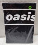 1 x Oasis Band T-Shirt - Colour: Black - Size: Medium - New in Sealed Packet - CL720 - Location: