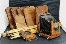 A mixed lot of early photographic equipment: to include an unmarked camera; various plates including