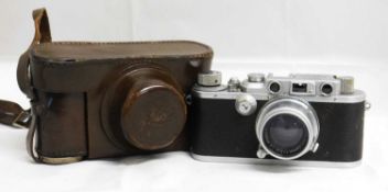 A Leica IIIa, serial no. 252800, c. 1937, with Leica Summar lens serial no. 282204, with Leica brown