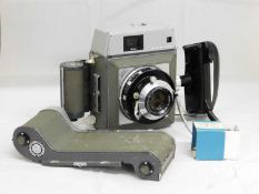 A Mamiya Press Rangefinder, with spare Mamiya 6x7 Roll Film Adapter and Mamiya Press Tripod Base,