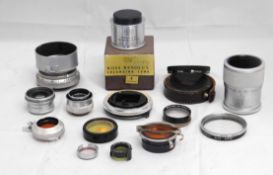 A quantity of lenses and accessories: to include a Plaubel AG Frankfurt AM no. 107208 Anticomar f-