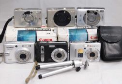 A quantity of modern compact camera's: to include Canon Ixus; Samsung S85; Tchnicka; Agfa; and