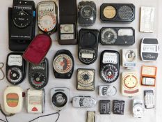 A quantity of assorted light meters and other accessories