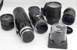 A quantity of camera lenses: to include a Sigma DL Hyperzoom Macro 28-200mm no. 1026833 with Luxon