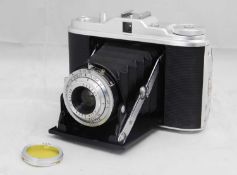 An Agfa Isolette camera with Agfa yellow lens filter