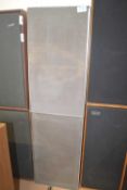 A pair of vintage Leak speakers with metal grills