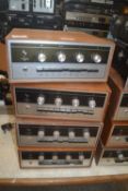 A group of four Armstrong 521 stereo amplifiers