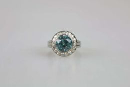 18K WG Ring mit hellblauem Farbstein