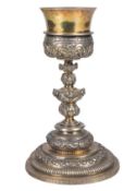 Embossed and chased gilded silver chalice. Mexico. Dated 1736.