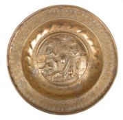 A Nuremberg gilded, embossed and punched brass alms dish. Germany. 16th century.