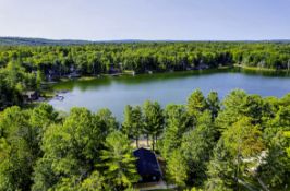 Retreat to Lakes of the North, Michigan: Nearly Half-Acre Lot Walking Distance to Pencil Lake!