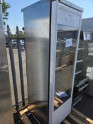 Large Free Standing Stainless Steel and Glass Refrigerator with Plastic Display Shelves.