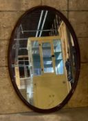 Oval Wall Mirror with a Wooden Frame