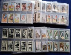 Cigarette cards, 24 sets in plastic sleeves, many issuers including Ardath Life in the Services,