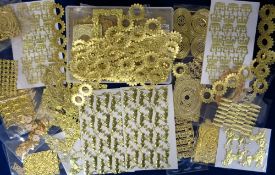 Scraps, gold and silver scrap adornments to include lions, crowns, frames, escutcheons, flowers,