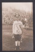 Football postcard, Tottenham Hotspur, photographic postcard showing a fan standing on the pitch with