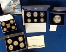 Coins, a collection of 4 boxed coin sets to comprise The Britannia Five Ounce Silver Medal, The 2002