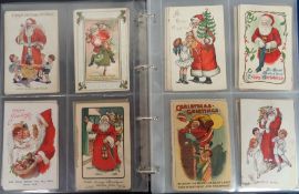 Postcards, a collection of 80+ Xmas cards of Santa, in black modern album, the majority with red