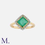 An Emerald And Diamond Ring
