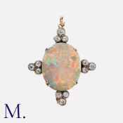 An Antique Opal and Diamond Brooch in gold and silver, set with a large brightly-coloured opal (with