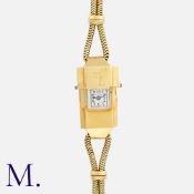 CARTIER, A Rare And Unusual 1932 Ladies Wristwatch in 18k yellow gold, the rectangular case with