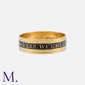 A Georgian Enamel Mourning Ring in yellow gold, decorated in black and white enamel featuring the