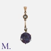 An Antique Star Sapphire Pendant in yellow gold, set with a cabochon sapphire weighing approx. 14.