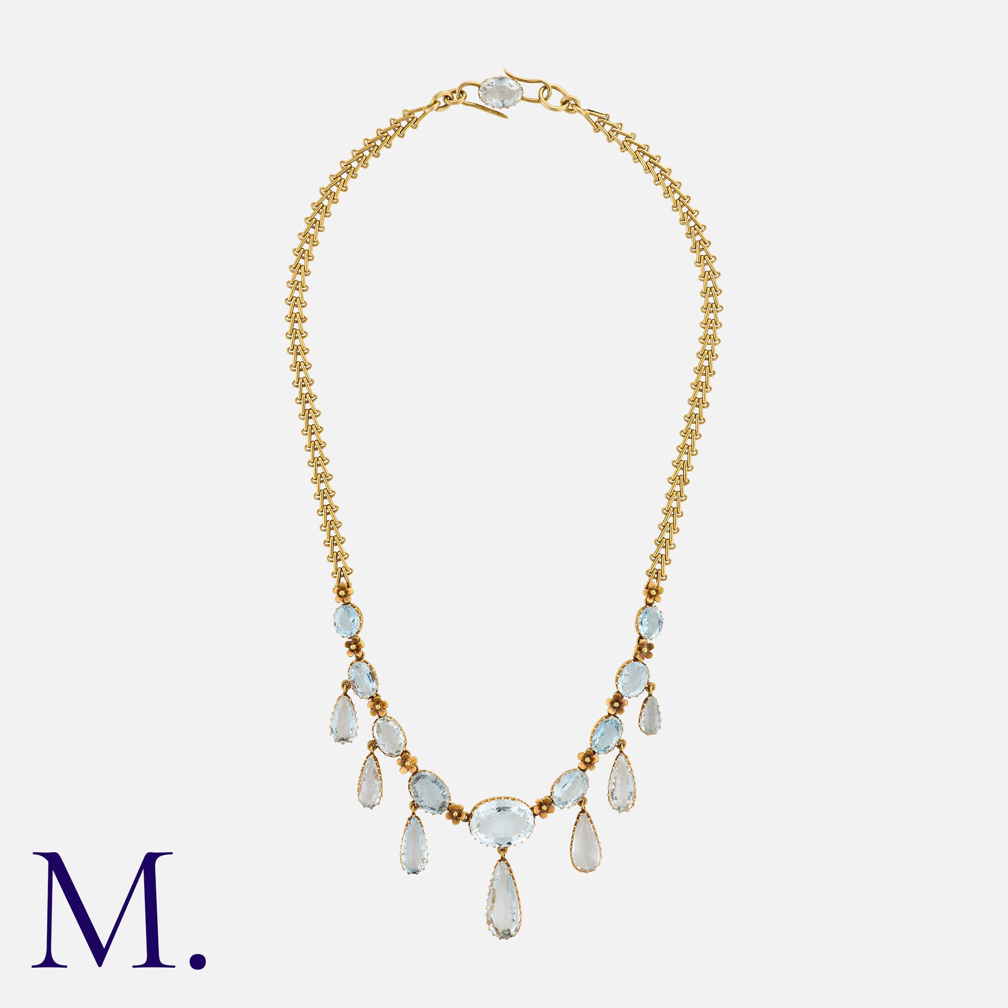 MRS NEWMAN, An Aquamarine Fringe Necklace in yellow gold, comprising a row of oval cut aquamarines