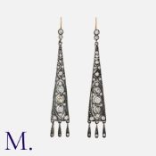 A Pair Of Old Cut Diamond Drop Earrings in yellow gold and silver, each of elongated triangular