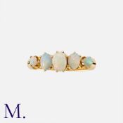 An Antique Opal Five Stone Ring in 18K yellow gold, set with five opal cabochons. Hallmarked for