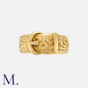 A Buckle Ring in 18k yellow gold, designed as a belt buckle with engraved floral decoration. Full