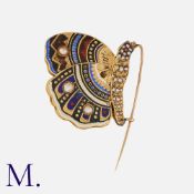 A Pearl And Enamel Butterfly Brooch in 18k yellow gold, set with pearls and decorated with fine