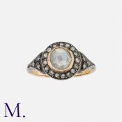 A Rose Cut Diamond Cluster Ring in 18k yellow gold and silver, set with a central rose cut diamond