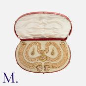 An Early Pearl and Enamel Parure with Box including a 5-row pearl collar, two 8-row pearl