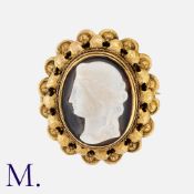 An Antique Hardstone Cameo Brooch carved in sardonyx with yellow gold frame. The cameo depicting a