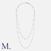 A Diamond Sautoir Chain, comprising a series of interlocking links, punctuated by knot motifs and