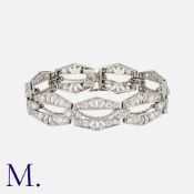 An Art Deco Diamond Bracelet in platinum, set with round cut diamonds weighing approx. 7.5ct in