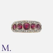 A Garnet And Diamond Ring in 18k yellow gold, set with five round cut garnets, within a border of