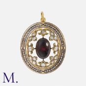 An Antique Garnet, Diamond And Enamel Pendant in yellow gold, set with a large cabochon garnet